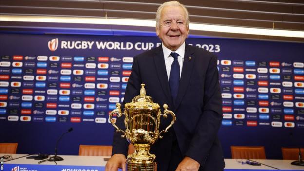 Sir Bill Beaumont poses with the Rugby World Cup trophy