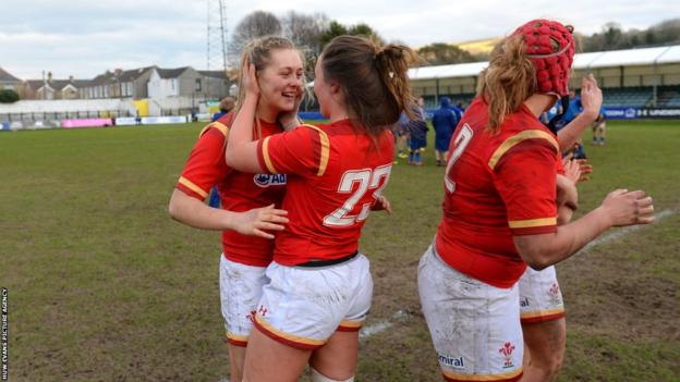 Hannah Jones, Alisha Butchers and Carys Phillips celebrate their 2016 Women's Six Nations victory over France at the Gnoll