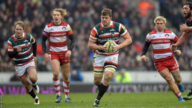 Ed Slater (centre) runs with the ball for Leicester during a Premiership match against Gloucester in 2017