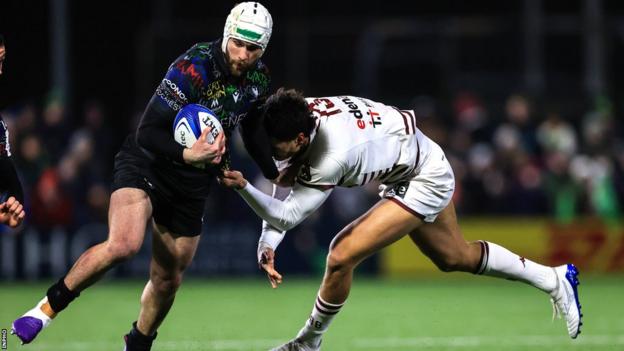 Connacht's Mack Hansen attempts to get past Bordeaux's Nicolas Depoortere in Galway