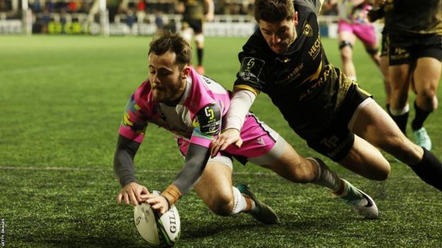 Iwan Stephens of Newcastle Falcons scores his team's second try during the Challenge Cup match against Montpellier