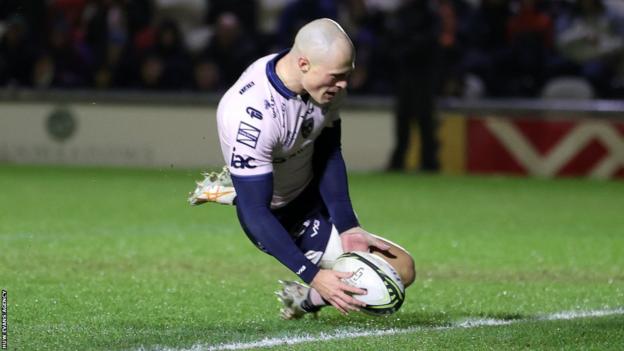 Jared Rosser dives on ball