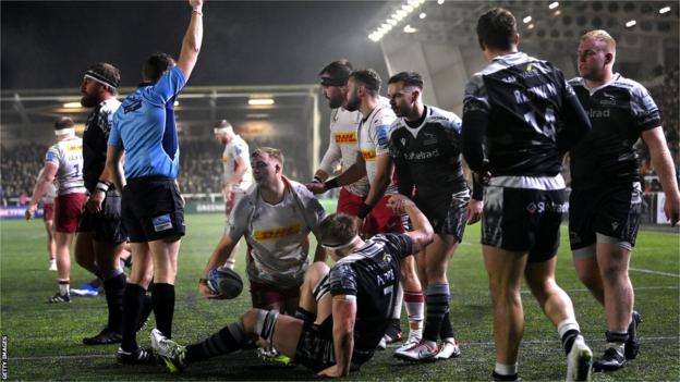 Jack Walker emerges from a maul as a tryscorer for Harlequins