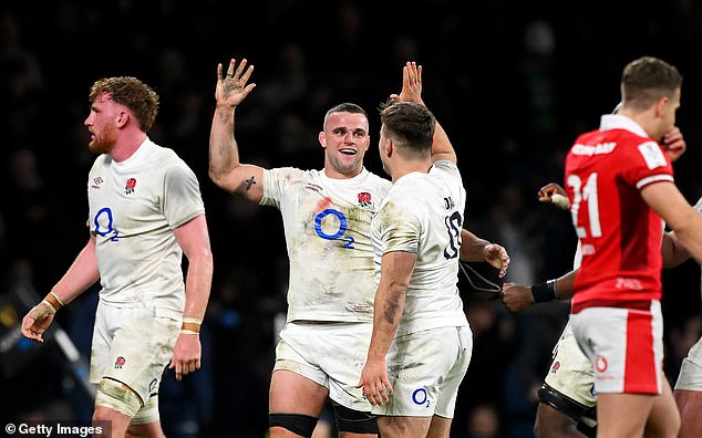 Ben Earl of England celebrates with team-mate Theo Dan during the win against Wales