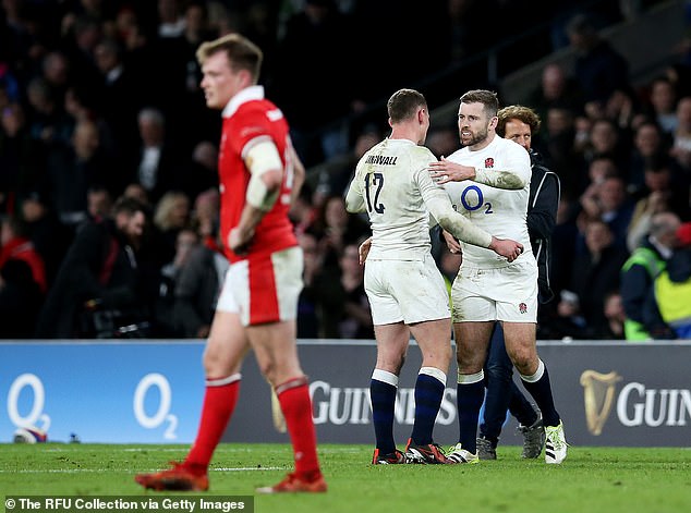 The England players celebrated after the final whistle in front of a dejected Nick Tompkins