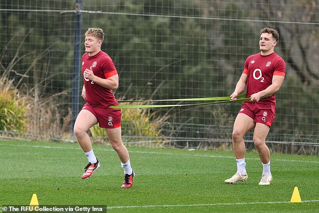 Fin Smith and Oscar Beard use the elastic band, one of thousands of pieces of equipment England take with them