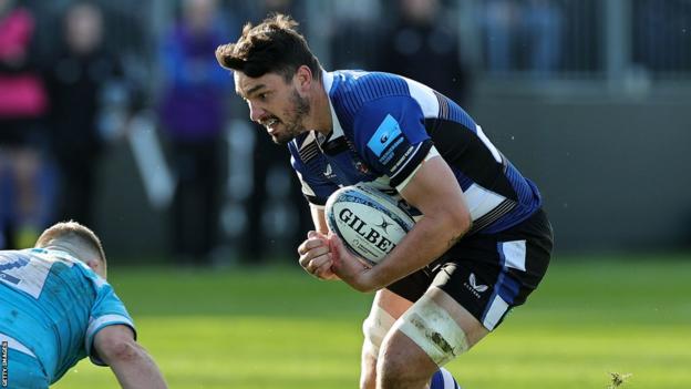 Jaco Coetzee braces himself for a tackle while holding the ball during Bath's win against Sale