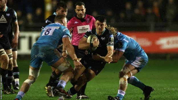 Reuben Morgan-Williams of Ospreys is tackled by JL du Preez of Sale