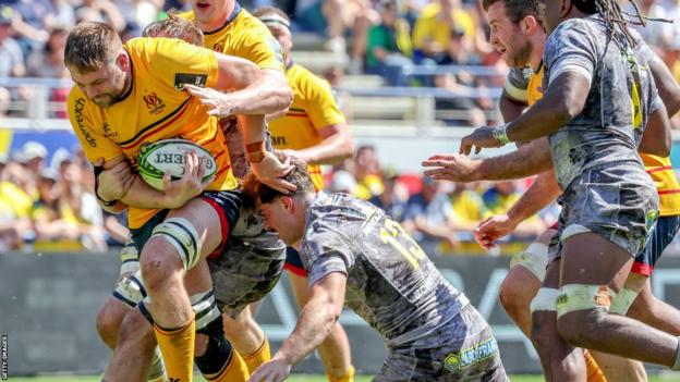 Iain Henderson is tackled against Clermont