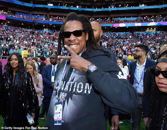 The American rapper, above, wears Roc Nation Sports gear at the Super Bowl back in February