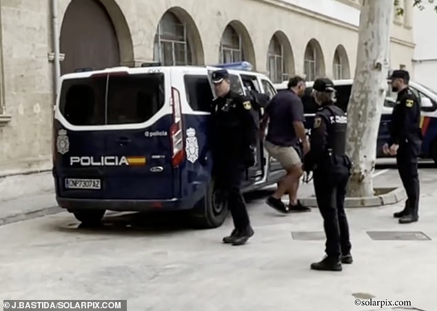 The 6ft 2in tall professional, who weighs nearly 20 stone, is said to have been unaffected by the first taser volt police used on him after clearing the bar. Pictured with police