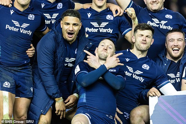 Kinghorn (second right) enjoys the Calcutta Cup victory alongside fun-loving  Finn Russell