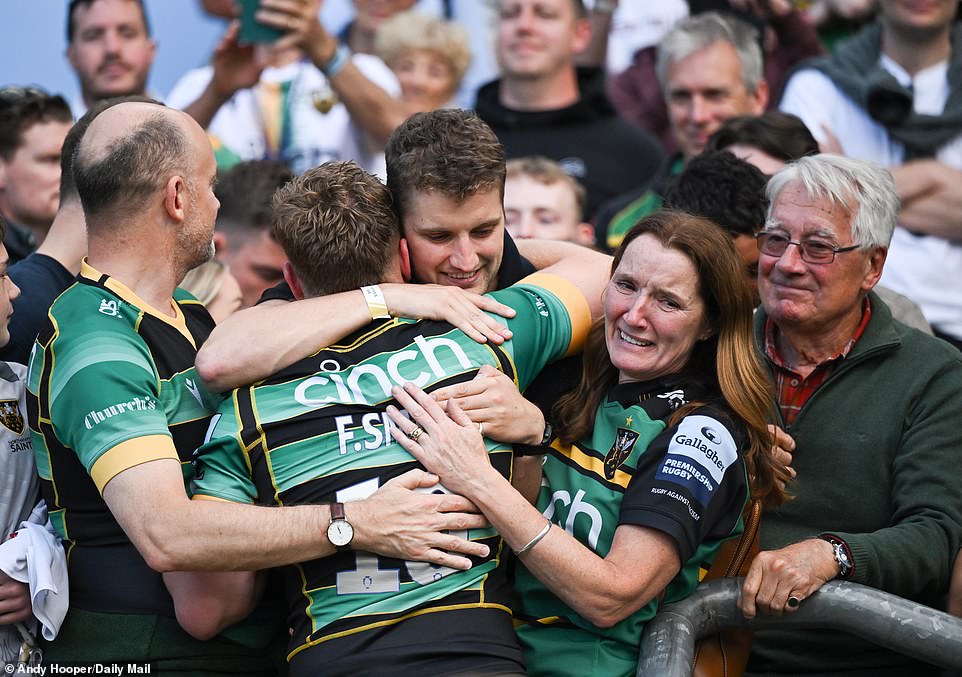 An emotional Finn Smith, a three-cap England international, celebrated with his family after the title had been secured