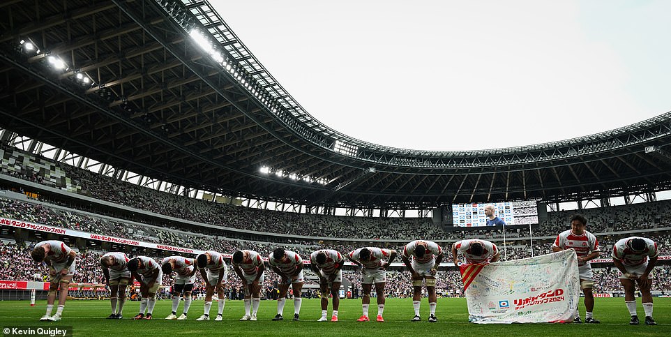 Japan's players bow to fans at the 80,016 capacity arena. Bowing to fans has traditionally been part of Japanese rugby culture