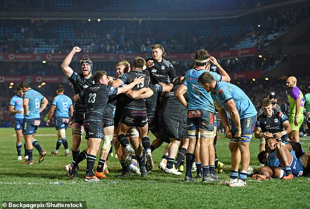 Warriors celebrate at the final whistle after holding on for a famous win in Pretoria