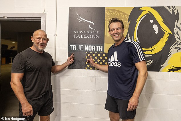 Diamond and Bywater pictured pointing to the 'True North' sign at the Kingston Park stadium