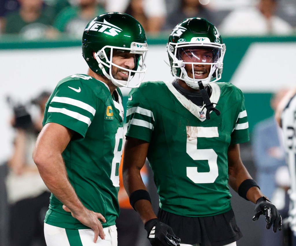 Jets quarterback Aaron Rodgers #8, with New York Jets wide receiver Garrett Wilson