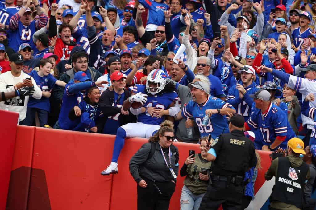 ORCHARD PARK, NEW YORK - SEPTEMBER 08: Dorian Williams #42 of the Buffalo Bills celebrates with fans after recovering a fumble during the third quarter against the Arizona Cardinals at Highmark Stadium on September 08, 2024 in Orchard Park, New York.