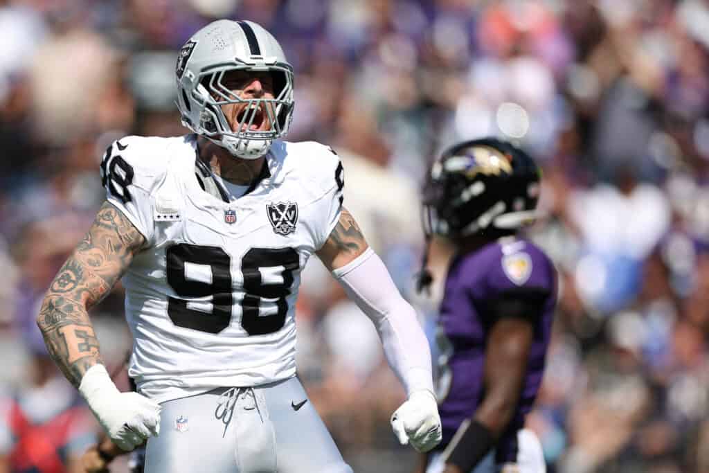 ALTIMORE, MARYLAND - SEPTEMBER 15: Maxx Crosby #98 of the Las Vegas Raiders celebrates after making a tackle against the Baltimore Ravens at M&T Bank Stadium on September 15, 2024 in Baltimore, Maryland.