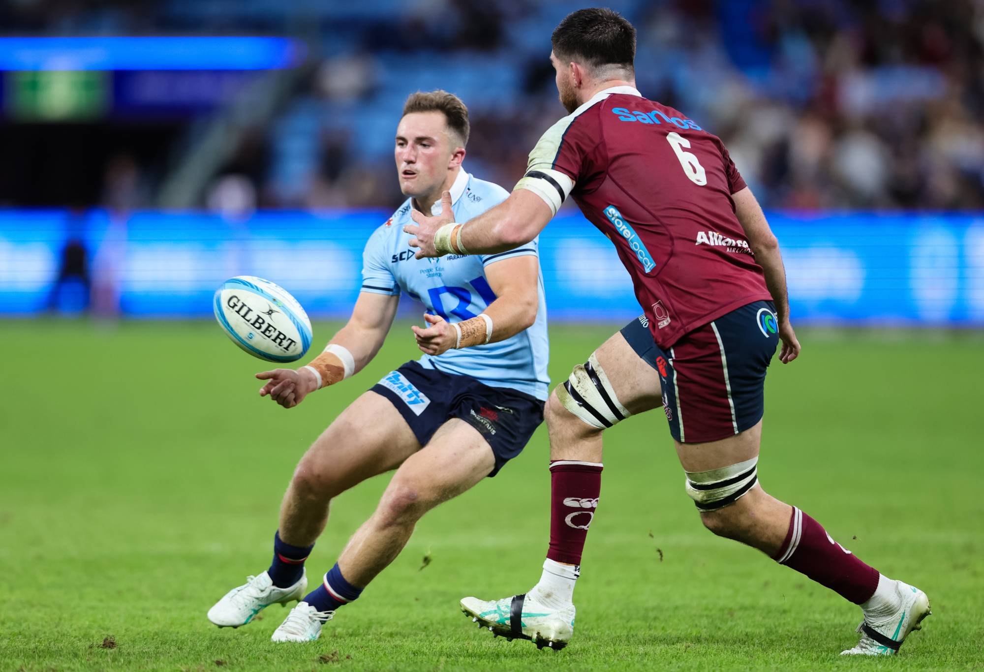 Jack Bowen of the Waratahs passes the ball during the Super Rugby Pacific match between NSW Waratahs and Queensland Reds at the Allianz Stadium on May 31, 2024 in Sydney, Australia. (Photo by Pete Dovgan/Speed Media/Icon Sportswire via Getty Images)