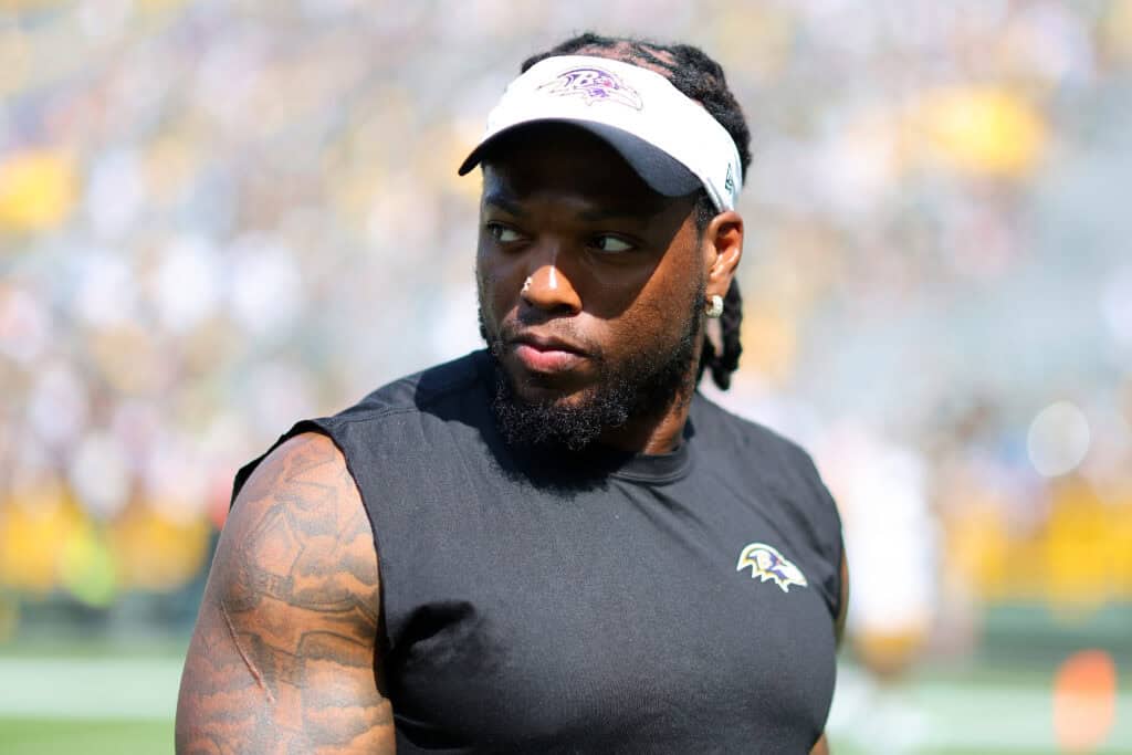 GREEN BAY, WISCONSIN - AUGUST 24: Derrick Henry #22 of the Baltimore Ravens leaves the field following a preseason game against the Green Bay Packers at Lambeau Field on August 24, 2024 in Green Bay, Wisconsin.