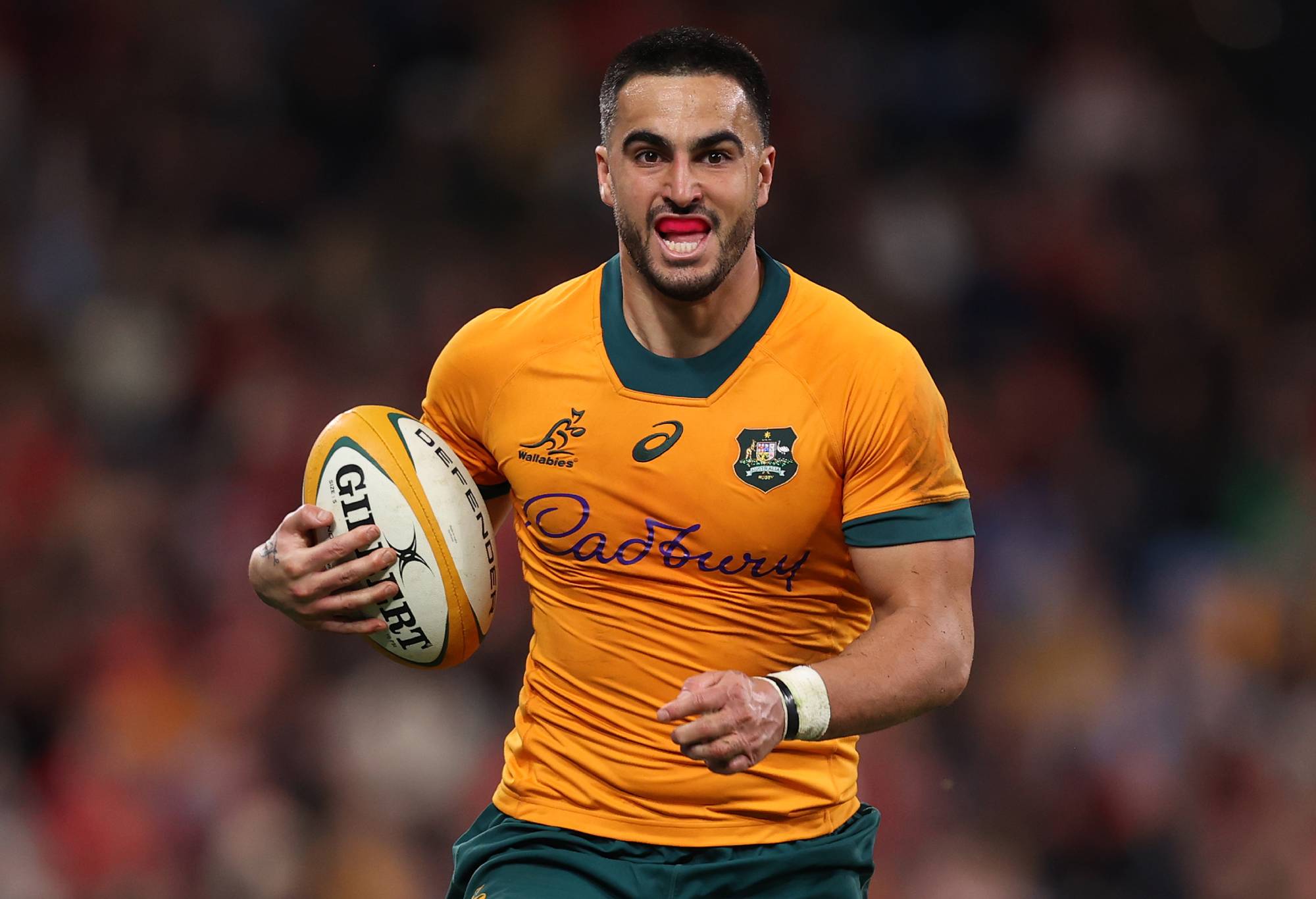 Tom Wright of the Wallabies runs the ball during the men's International Test match between Australia Wallabies and Wales at Allianz Stadium on July 06, 2024 in Sydney, Australia. (Photo by Jason McCawley/Getty Images)