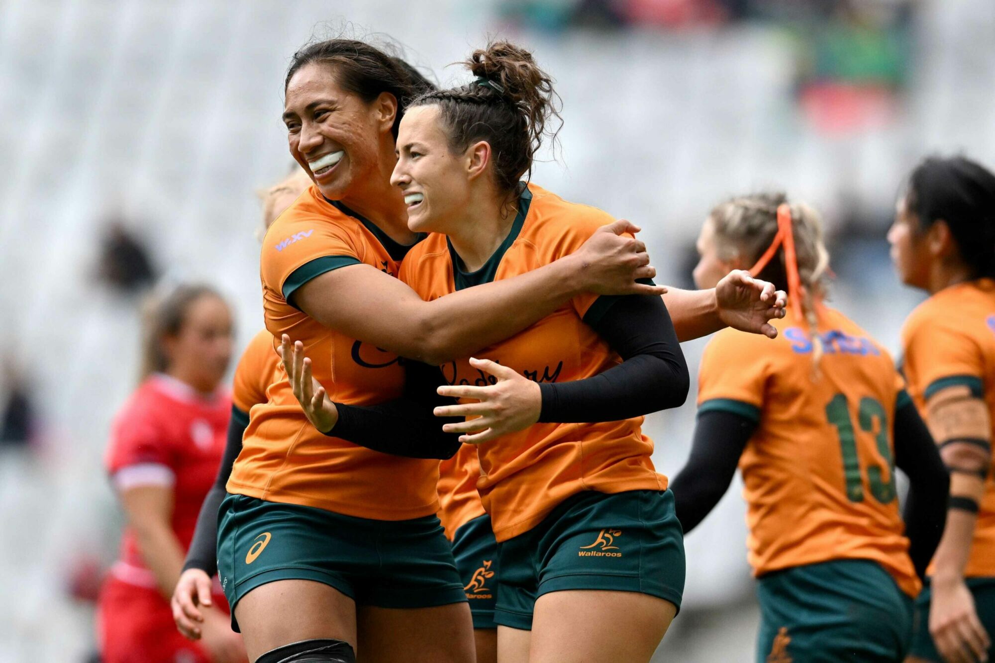 Wallaroos' Maya Stewart and Siokapesi Palu celebrate victory in their opening WXV 2 match against Wales (Source: Getty Images)