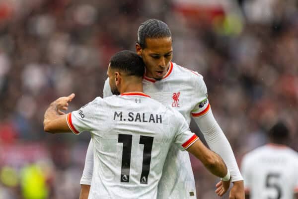 MANCHESTER, ENGLAND - Sunday, September 1, 2024: Liverpool's Mohamed Salah (L) celebrates with team-mate captain Virgil van Dijk after scoring the third goal during the FA Premier League match between Manchester United FC and Liverpool FC at Old Trafford. Liverpool won 3-0. (Photo by David Rawcliffe/Propaganda)