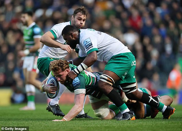 Ollie Chessum of Leicester Tigers is tackled by Temo Mayanavanua of Northampton