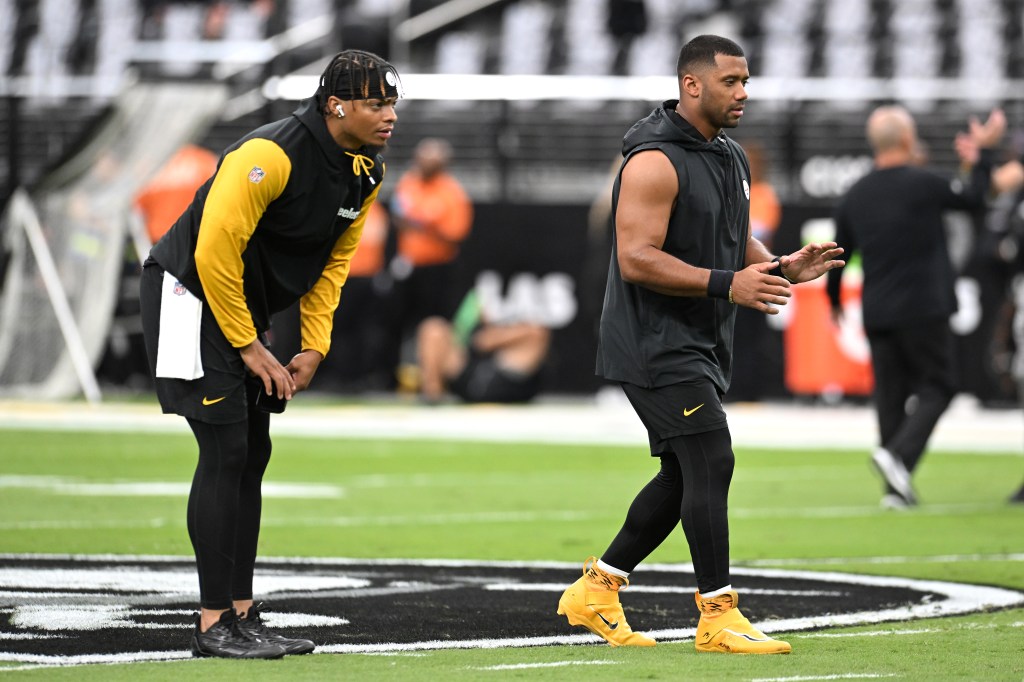 Justin Fields and Russell Wilson warming up on the football field before the Pittsburgh Steelers vs Las Vegas Raiders game on October 13, 2024