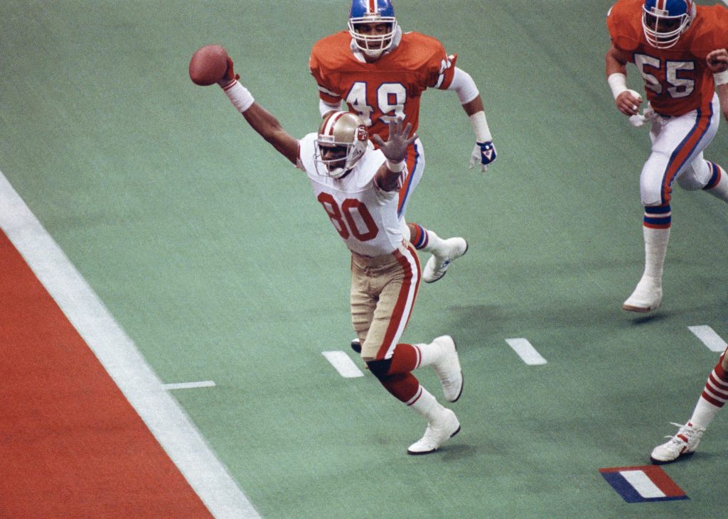 San Francisco 49ers wide receiver Jerry Rice celebrates his first-quarter touchdown against the Denver Broncos during NFL football's Super Bowl XXIV in New Orleans.