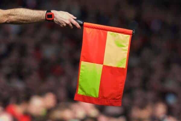 LIVERPOOL, ENGLAND - Sunday, March 22, 2015: An assistant referee flags for off-side during the Premier League match at Anfield. (Pic by David Rawcliffe/Propaganda)