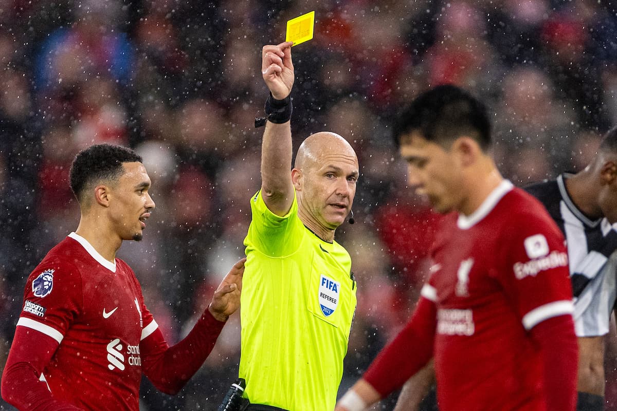 LIVERPOOL, ENGLAND - Monday, January 1, 2024: Liverpool's Wataru Endo is shown a yellow card by referee Anthony Taylor during the FA Premier League match between Liverpool FC and Newcastle United FC on New Year's Day at Anfield. Liverpool won 4-2. (Photo by David Rawcliffe/Propaganda)