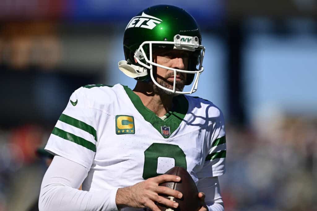 FOXBOROUGH, MASSACHUSETTS - OCTOBER 27: Aaron Rodgers #8 of the New York Jets warms up prior to the game against the New England Patriots at Gillette Stadium on October 27, 2024 in Foxborough, Massachusetts.