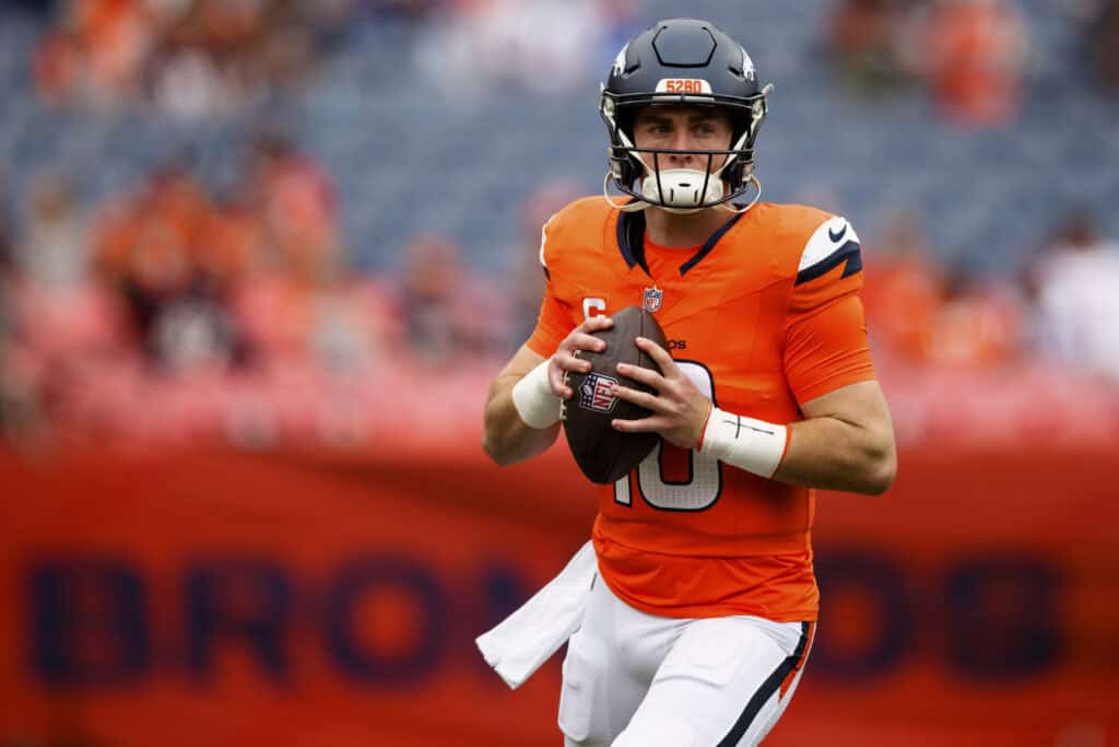 DENVER, COLORADO - OCTOBER 27: Bo Nix #10 of the Denver Broncos warms up before the game against the Carolina Panthers at Empower Field At Mile High on October 27, 2024 in Denver, Colorado.