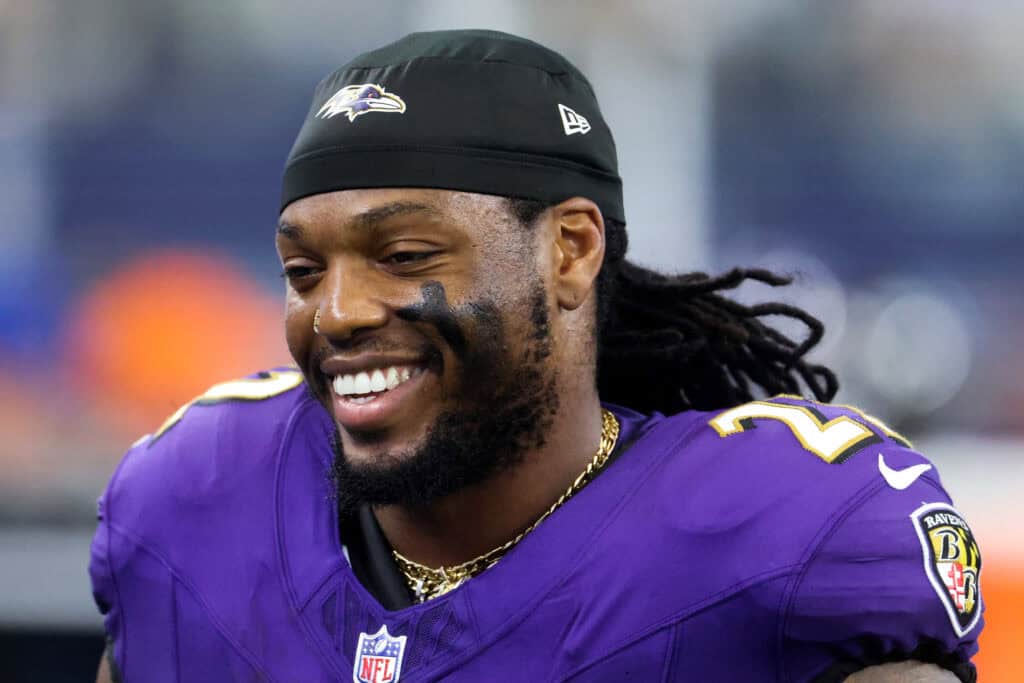 ARLINGTON, TEXAS - SEPTEMBER 22: Derrick Henry #22 of the Baltimore Ravens looks on against the Dallas Cowboys during the third quarter at AT&T Stadium on September 22, 2024 in Arlington, Texas.