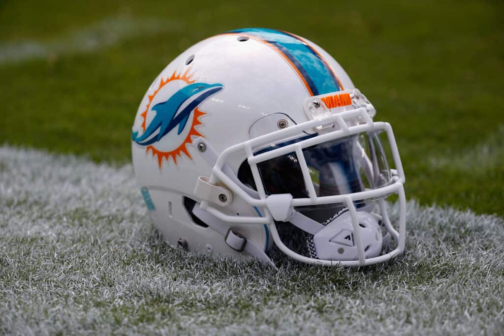 LANDOVER, MD - SEPTEMBER 13: A Miami Dolphins helmet sits on the grass before the start of their game against the Washington Redskins at FedExField on September 13, 2015 in Landover, Maryland.