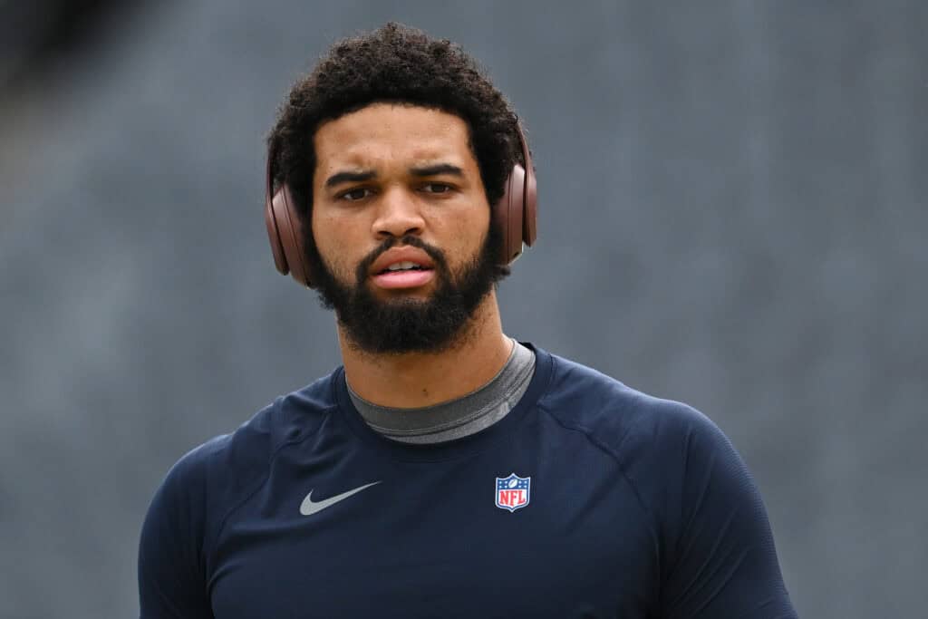 CHICAGO, ILLINOIS - AUGUST 17: Caleb Williams #18 of the Chicago Bears warms up before a preseason game against the Cincinnati Bengals at Soldier Field on August 17, 2024 in Chicago, Illinois.