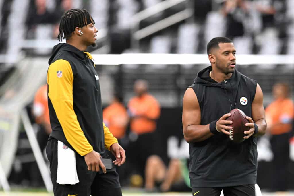 LAS VEGAS, NEVADA - OCTOBER 13: (L-R) Justin Fields #2 and Russell Wilson #3 of the Pittsburgh Steelers warm-up prior to a game against the Las Vegas Raiders at Allegiant Stadium on October 13, 2024 in Las Vegas, Nevada.