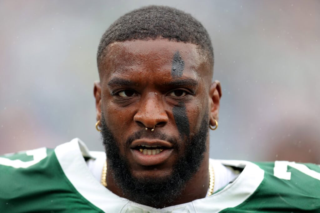 EAST RUTHERFORD, NEW JERSEY - SEPTEMBER 29: Haason Reddick (7) of the New York Jets looks on against the Denver Broncos during the first half at MetLife Stadium on September 29, 2024 in East Rutherford, New Jersey.