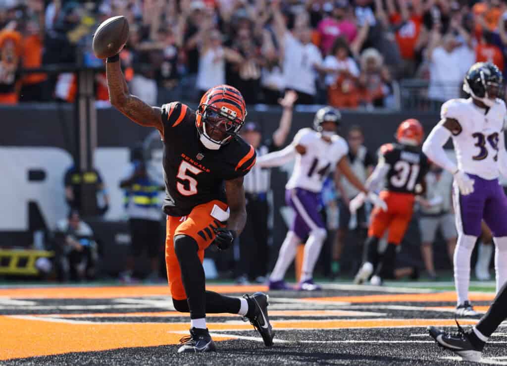 CINCINNATI, OHIO - OCTOBER 06: Tee Higgins #5 of the Cincinnati Bengals celebrates a touchdown against the Baltimore Ravens during the third quarter at Paycor Stadium on October 06, 2024 in Cincinnati, Ohio. 