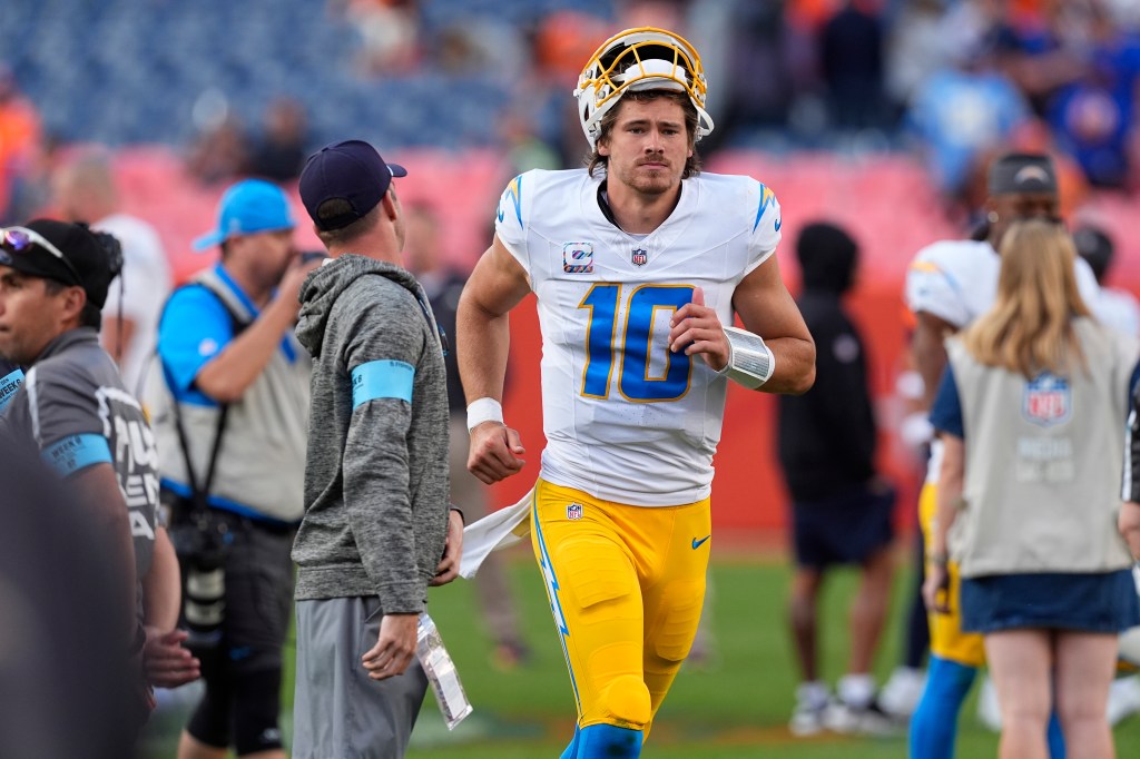 Los Angeles Chargers quarterback Justin Herbert heads off the field after an NFL football game against the Denver Broncos, Sunday, Oct. 13, 2024, in Denver. 