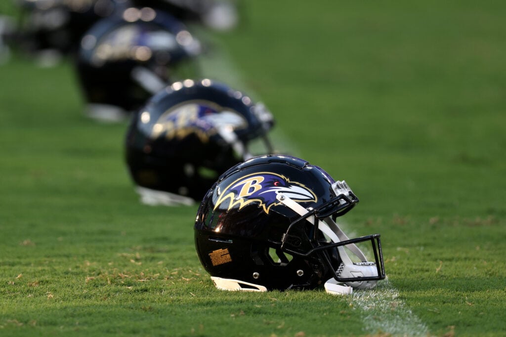 BALTIMORE, MARYLAND - AUGUST 11: Baltimore Ravens helmets sit on the field before the start of the Ravens and Tennessee Titans preseason game at M&T Bank Stadium on August 11, 2022 in Baltimore, Maryland.