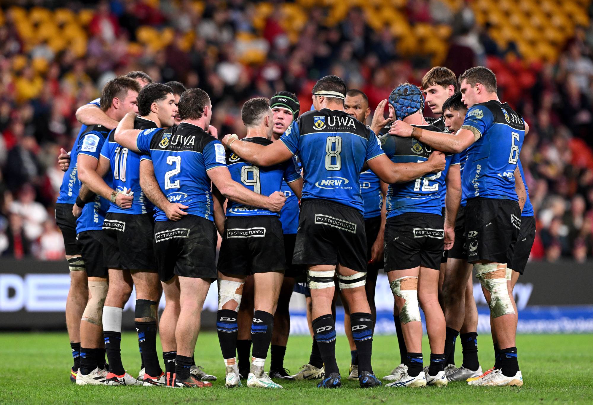 Western Force players embrace during the round 14 Super Rugby Pacific match between Queensland Reds and Western Force at Suncorp Stadium, on May 25, 2024, in Brisbane, Australia. (Photo by Bradley Kanaris/Getty Images)