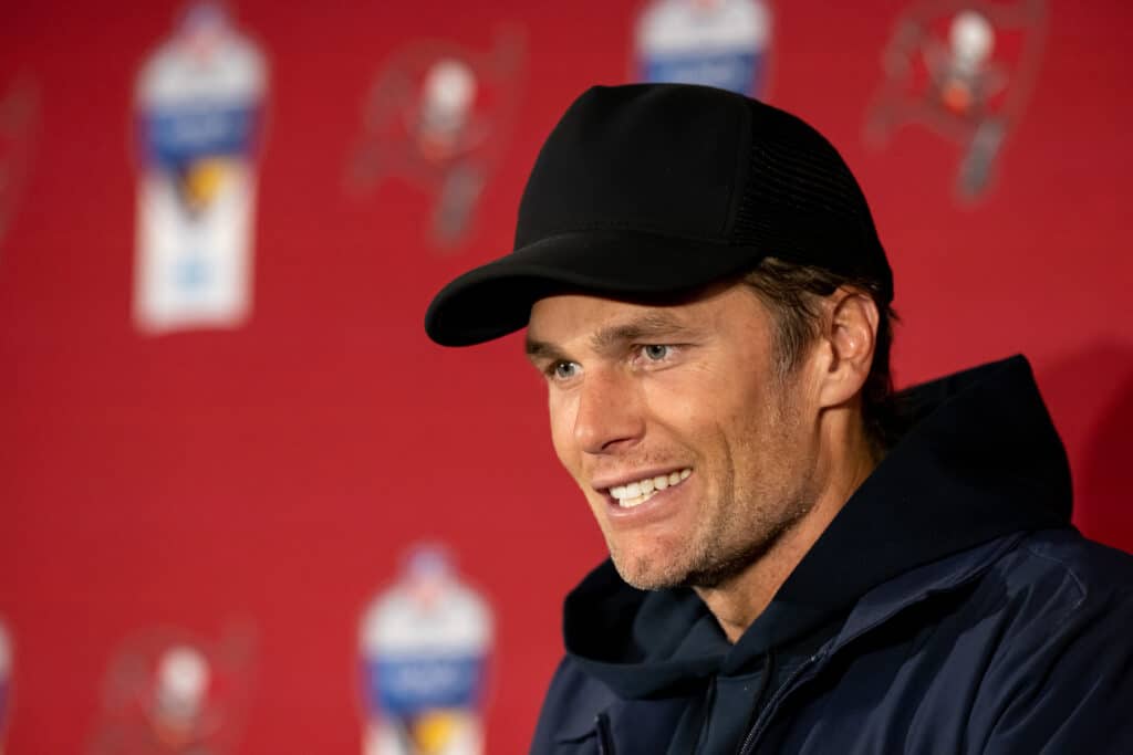 Tom Brady #12 of the Tampa Bay Buccaneers speaks to the media after their side's victory in the NFL match between Seattle Seahawks and Tampa Bay Buccaneers at Allianz Arena on November 13, 2022 in Munich, Germany.