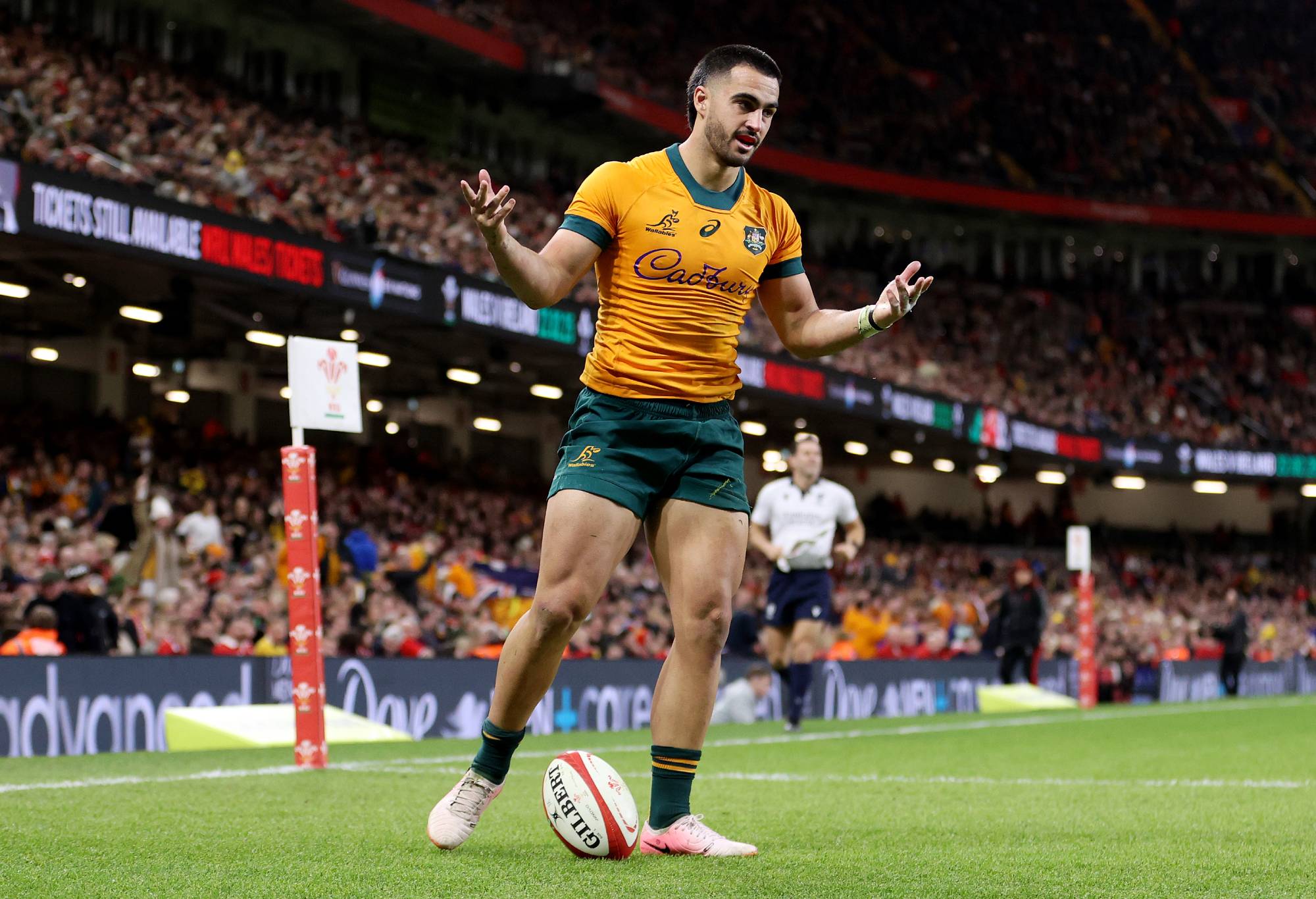 Tom Wright of Australia celebrates scoring his team's sixth try during the Autumn Nations Series 2024 match between Wales and Australia at the Principality Stadium on November 17, 2024 in Cardiff, Wales. (Photo by Michael Steele/Getty Images)