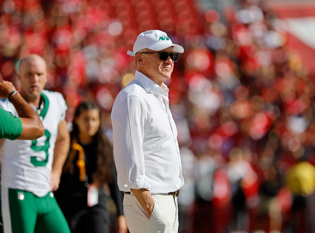  New York Jets owner Woody Johnson on the field for warms-up during pre-game, before the start of the first quarter.