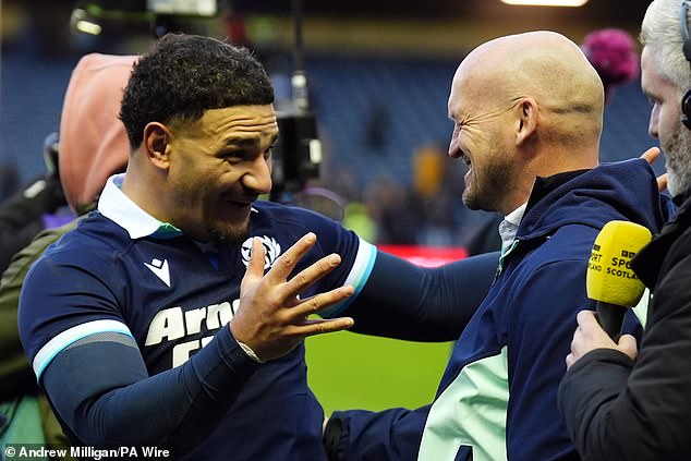 captain Sione Tuipulotu and coach Gregor Townsend celebrate after victory against Australia