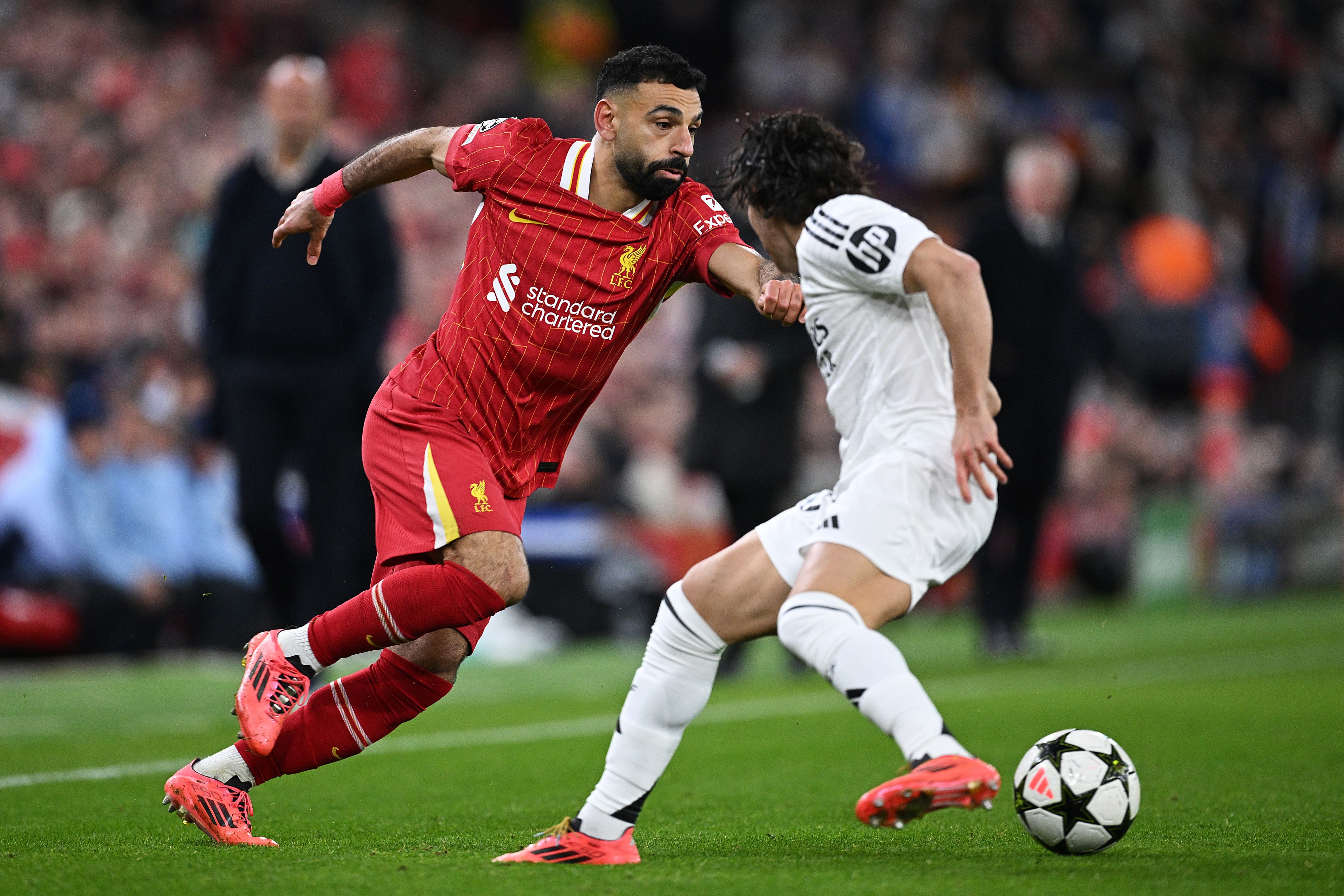 Mohamed Salah of Liverpool runs with the ball under pressure