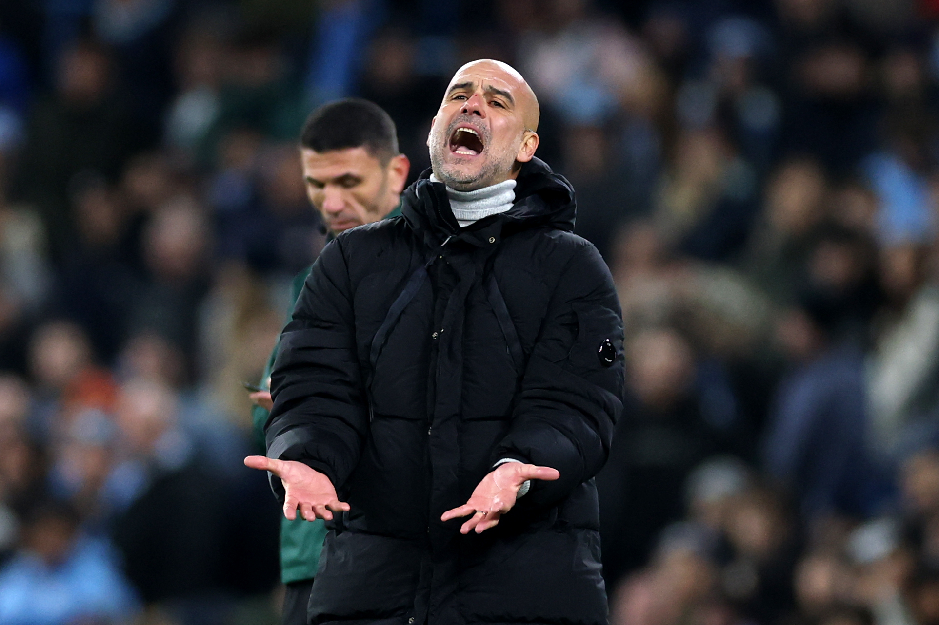 Pep Guardiola, Manager of Manchester City, reacts